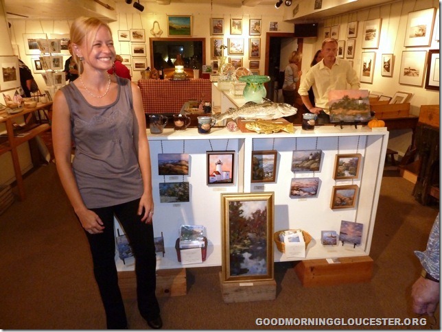 Kathleen Miller with some of her paintings