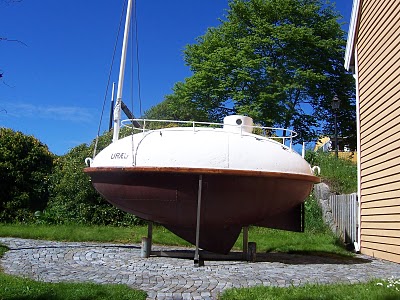 This is an accurate replica of Urad, in a Norwegian driveway. It'll give you a good idea of what she looked like before being battered by the North Atlantic. Don't forget that this was supposed to be a lifeboat, not a transatlantic vessel. I think she proved herself, right?