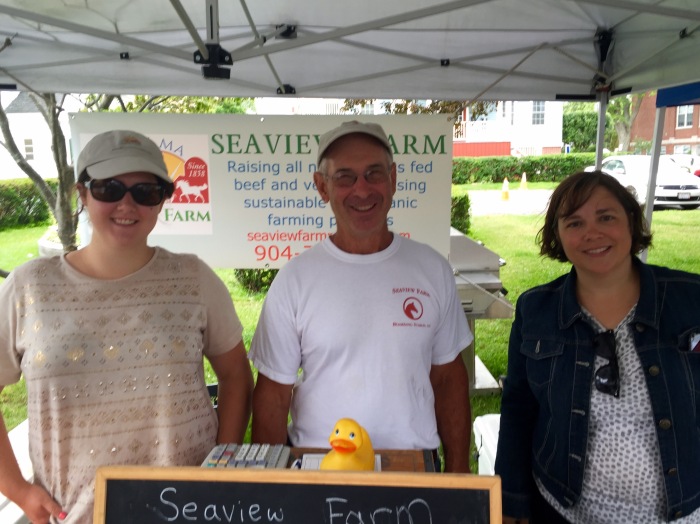 Emily and Ken from Seaview Farms and Sarah from Sarah Kelly! Sarah says Seaview is grilling genuine cow parts that were grass fed in Rockport from 11AM to 1PM down at the Farmers Market in Rockport! I love the hamburger parts of the cow!